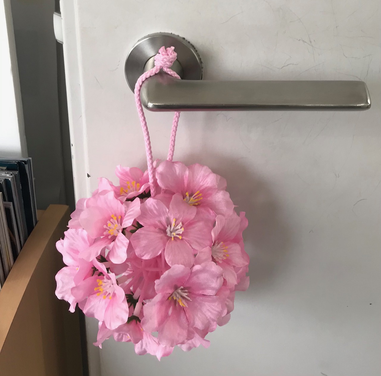 image of door handle with pink flowers